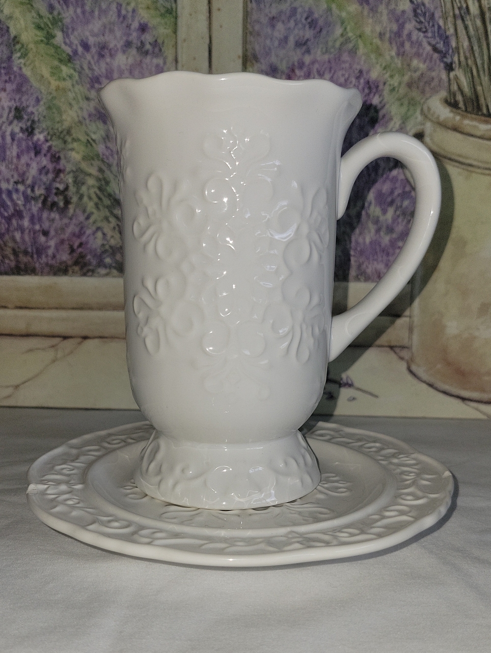 GANZ White Embossed Ceramic Mug with Saucer